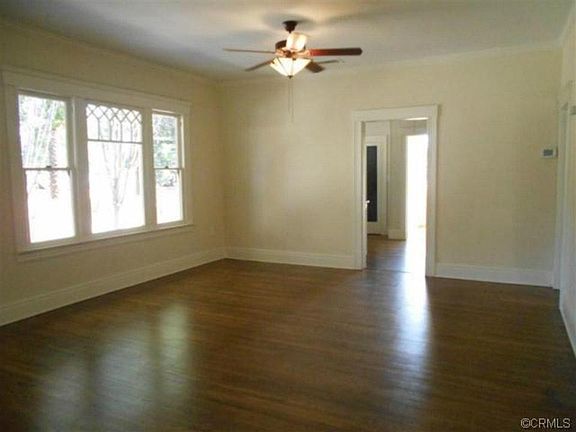 Living and dining room. (Walls are being repainted white).