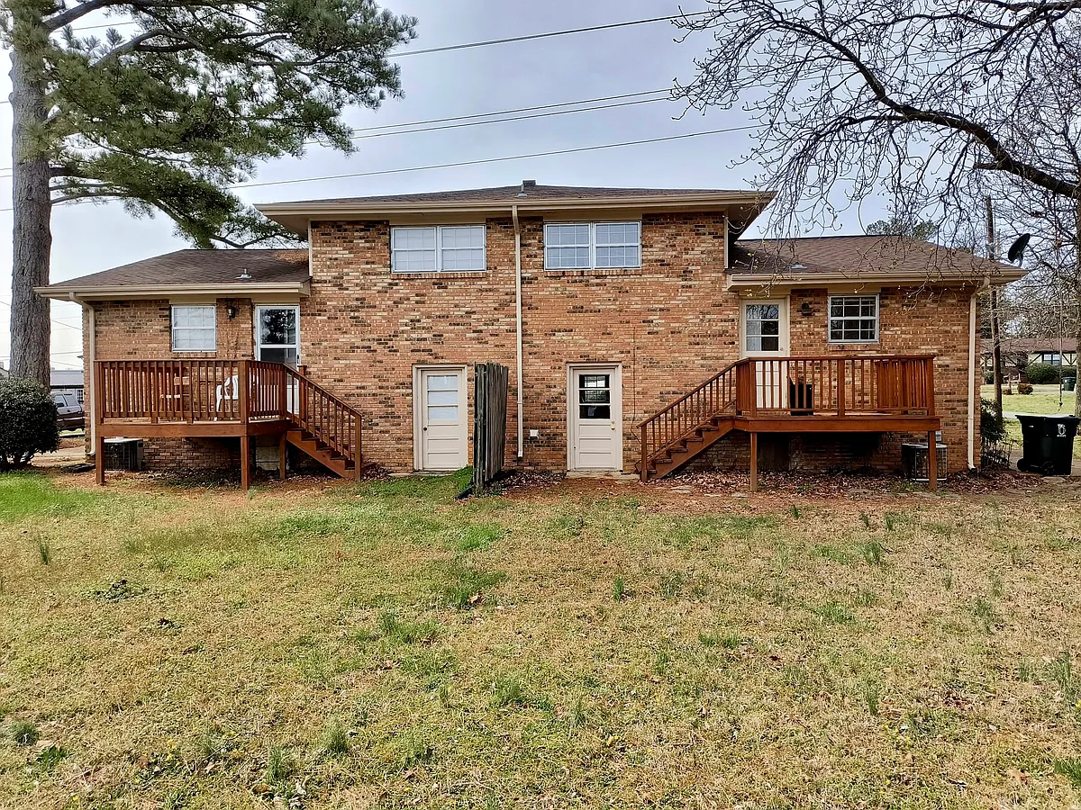 Nice deck off the back with a spacious yard. Mowing is included with your rent. - 1304 Park Forrest Dr #1304
