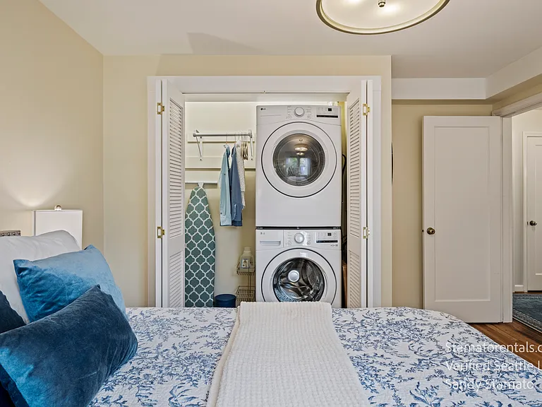A full-size LG washer and dryer are discreetly tucked inside the bedroom closet, providing everyday convenience without taking up living space.