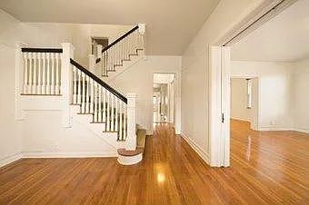 White Wolf Manor 3BR/3Bath FGO Family Room/Entry showcases the beautiful double staircase.