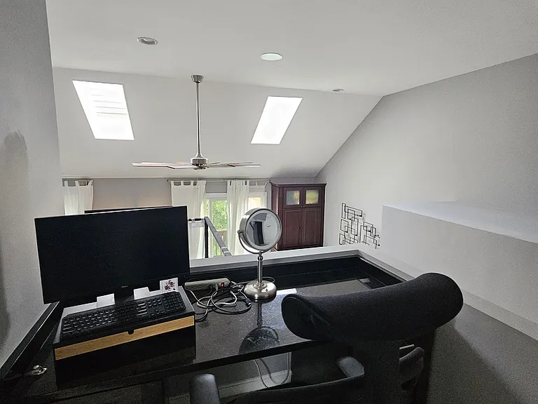 Desk area above primary bedroom
