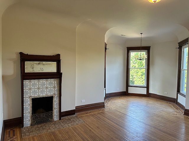 Living room. High ceilings, beautiful in-laid wood floors