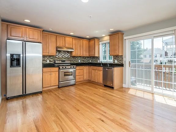 Large kitchen, Stainless appliances, new stove, vent hood, granite countertops