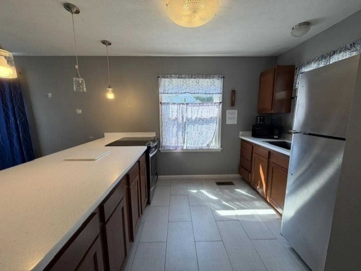 Updated 3BR Home with Open-Concept Kitchen, Bonus Lower-Level Bedroom & Garage — Photo 4
