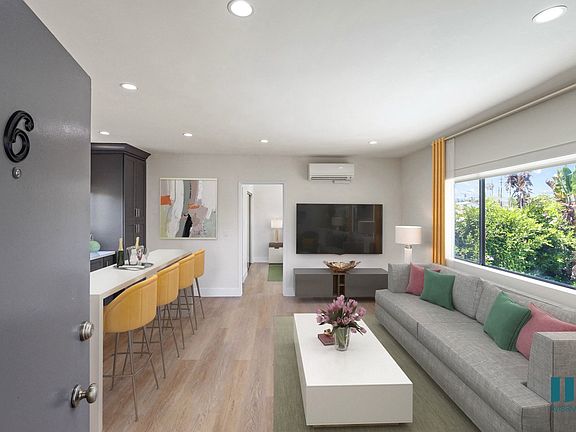 Front Entrance with Open-Concept Kitchen, Dining, and Living Room