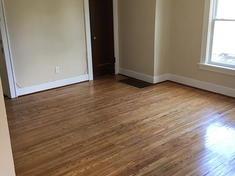 Living room. Coat closet and private access staircase descen