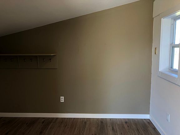 Mud room area with shelf and hooks
