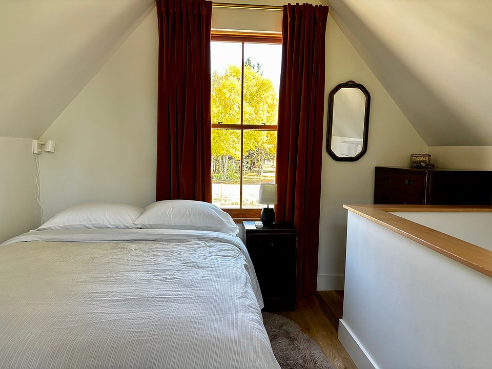 Upstairs bedroom with new queen bed. There are two dressers upstairs as well.
