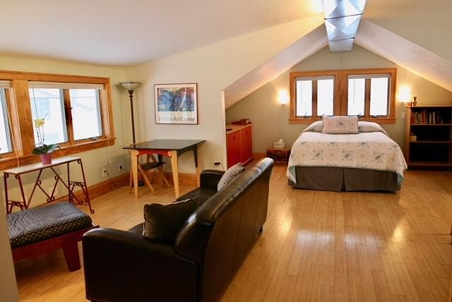 Sunny studio space with wood floors. Windows on all four sides!
