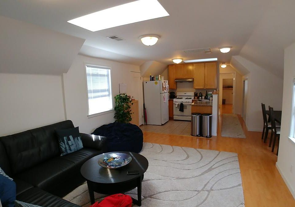View from main bedroom across living room and kitchen