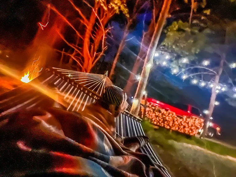 Peace at Night: Hammock views under warm string lights - your outdoor escape.