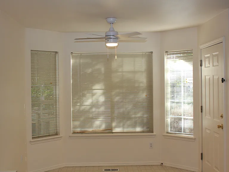 Dining Area With Beautiful View of Community Patio & Exit to Private Patio & Storage