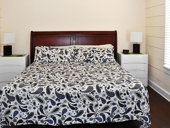 Master bedroom with built in closet (shown with California King bed and over sized drawer units).