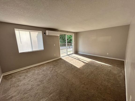 Front room with sliding glass doors to outdoor patio