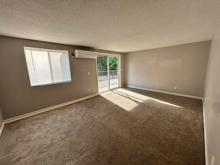 Front room with sliding glass doors to outdoor patio