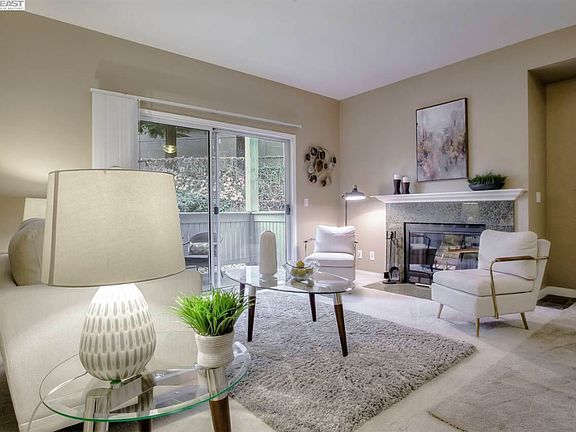 Living room of the unit with staging. The apartment is unfurnished.