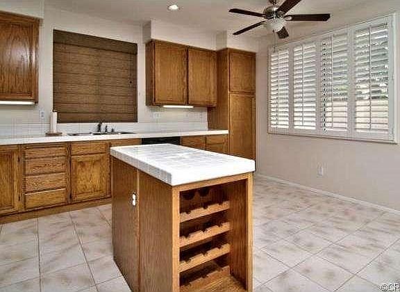 Kitchen as seen from family room.  Center island with wine stora