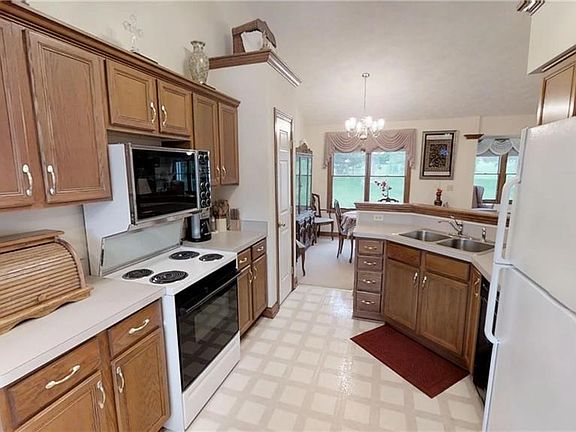 Vaulted ceilings continue throughout!  Open concept kitchen overlooks dining room.