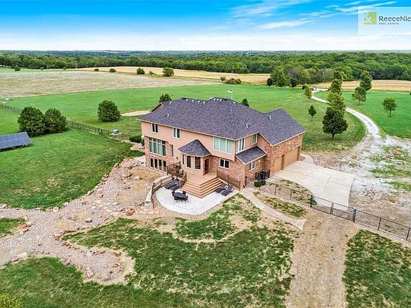 Custom rock landscaping in the front and rear yards adds a great architectural feature.