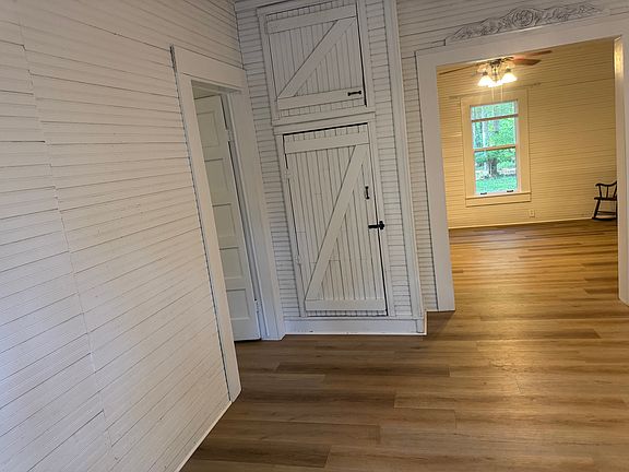 Living room looking into dining room. Shows closet for storage.