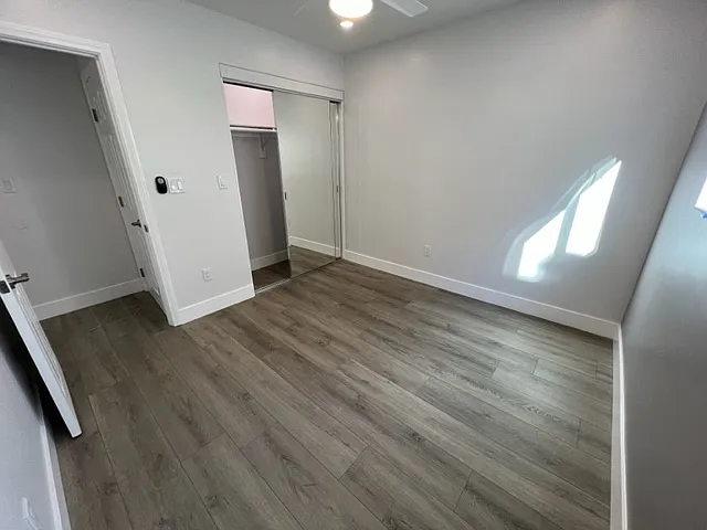 Bedroom #2 with large mirrored closet.