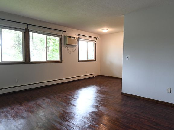 Looking from the entry door into the living room and dining area off to the far right. Living room is 19'3" X 11'10" . dining area is 8' X 8'. The plank flooring is new and beautiful.
