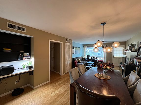 Small built-in desk on the left, adjacent to dining room