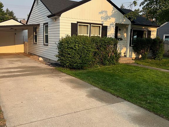 Front yard, driveway, garage