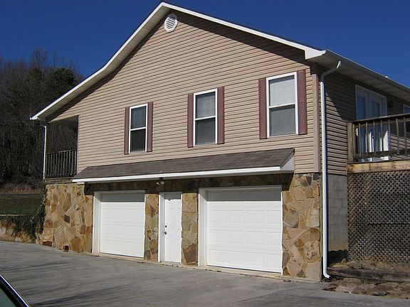 Side view with garage doors