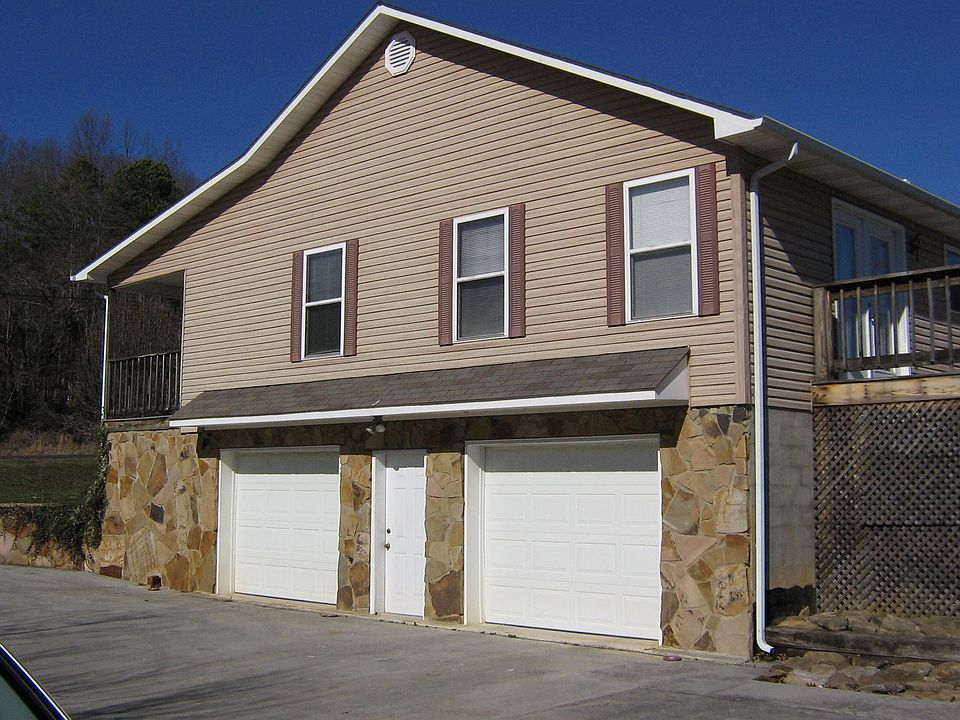 Side view with garage doors