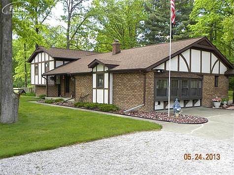 This home a a beautiful wooded lot and a large deck off the back.