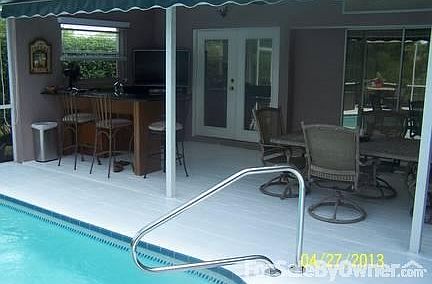 Great Pool Bar with Granite and storage
						:
						Huge patio area perfect for entertaining, built in sun-setter for shade control.