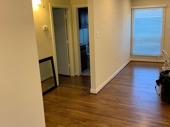 refinished floors, lots of windows
