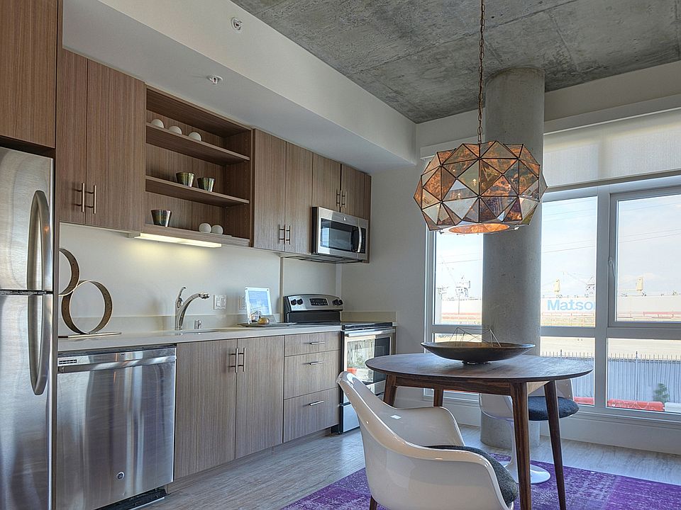 Stylish kitchen with stainless steel appliances and quartz countertops