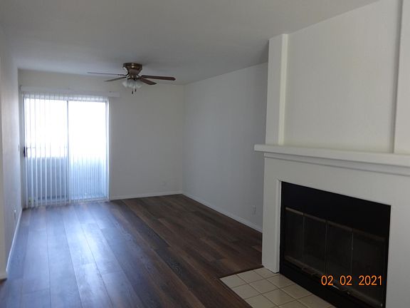 Looking into dining area with balcony beyond.