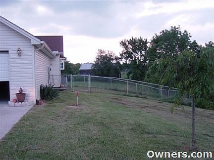 partially fenced back yard