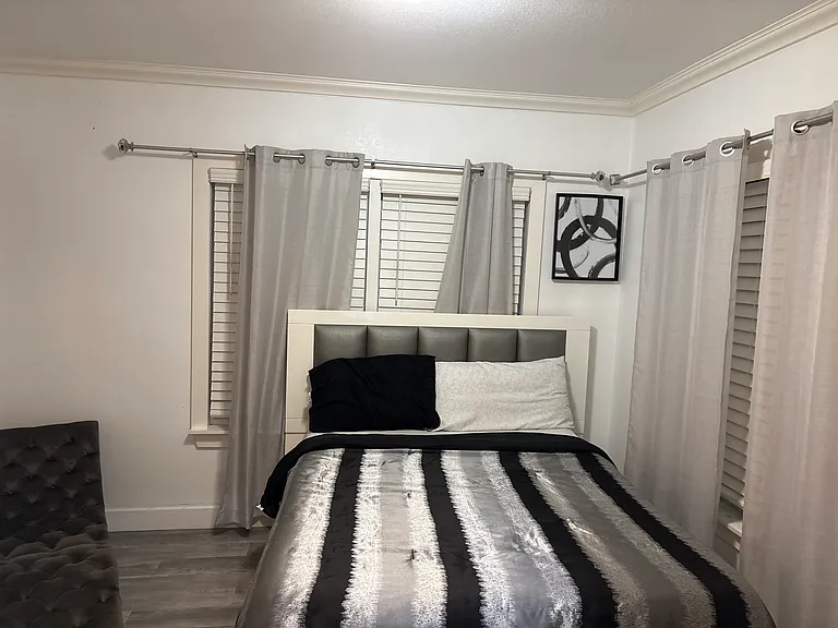 Bedroom with queen bed & television