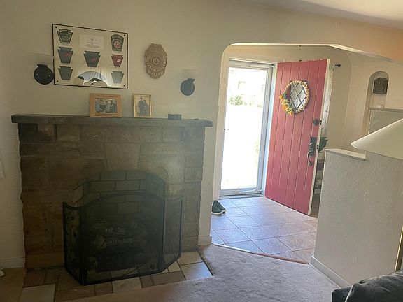 Fireplace in living room by entryway