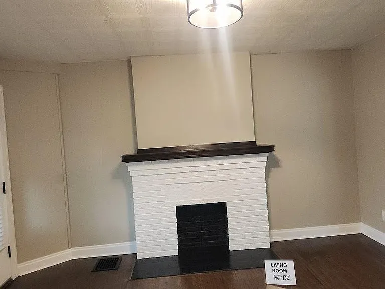 Living Room & front door entrance, 14'6" x 13'2", newly refinished hardwood floor, decorative fireplace, two windows, new locks, new wide cordless blinds, new ceiling light fixture, extra outlet installed