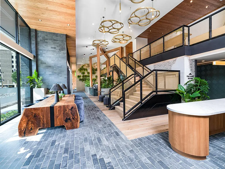 Make a grand entrance at Modera St. Paul, where the striking lobby blends natural textures with upscale design in the heart of Dallas.