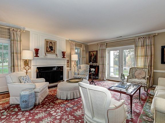 Living room with wood burning fireplace