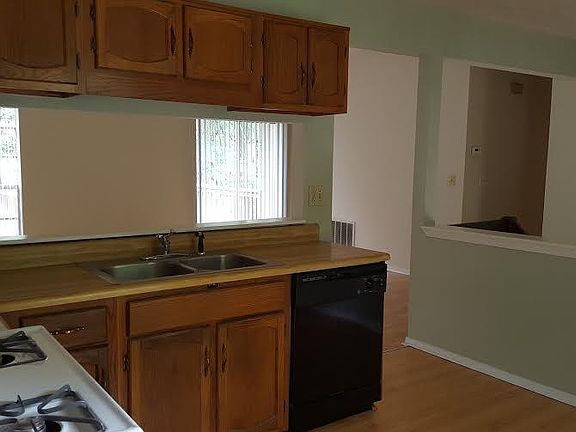 View of kitchen which opens to the foyer and family room.