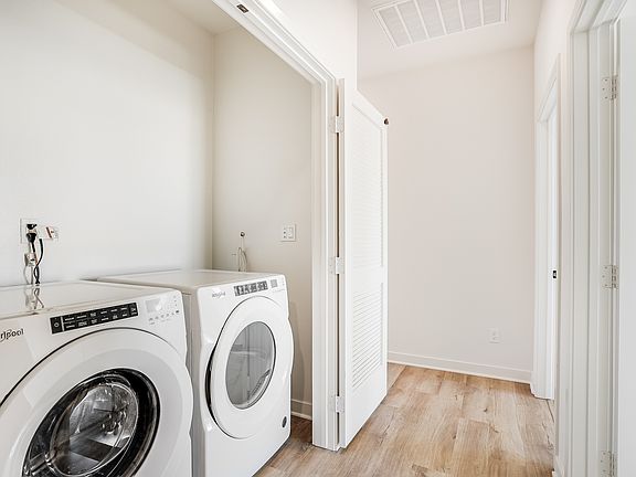 Side-by-side front loading washer and dryer in select homes.