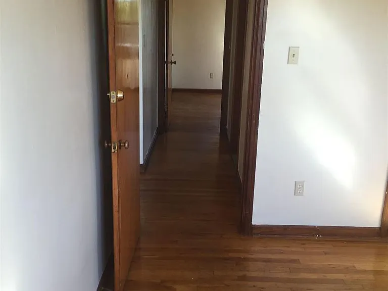 HALLWAY LOOKING INTO 2ND BEDROOM