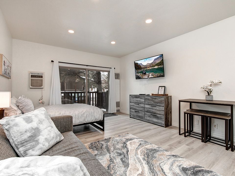 Main area showing bed, sofa, tv, dining table