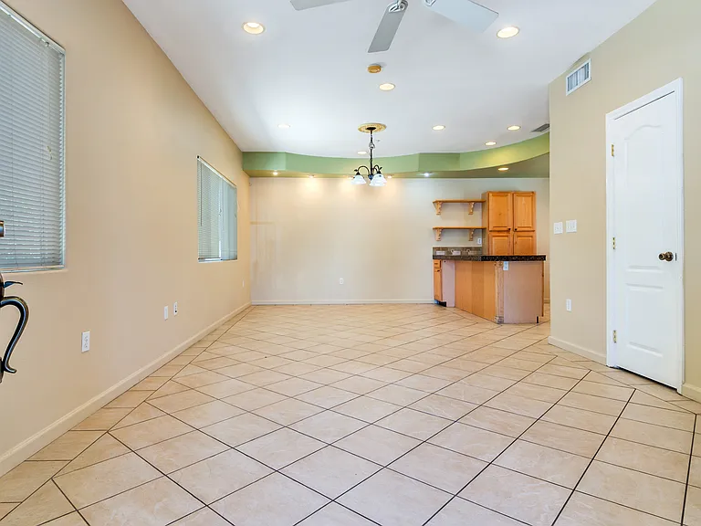 Recessed lighting and tile flooring.