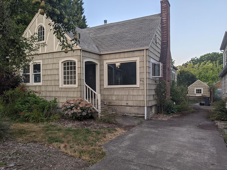 Long driveway for 2-3 cars, with storage shed visible in back.