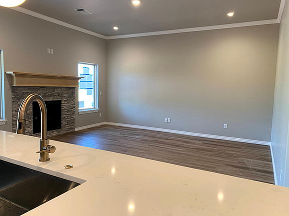 Living room, featuring a gas fireplace