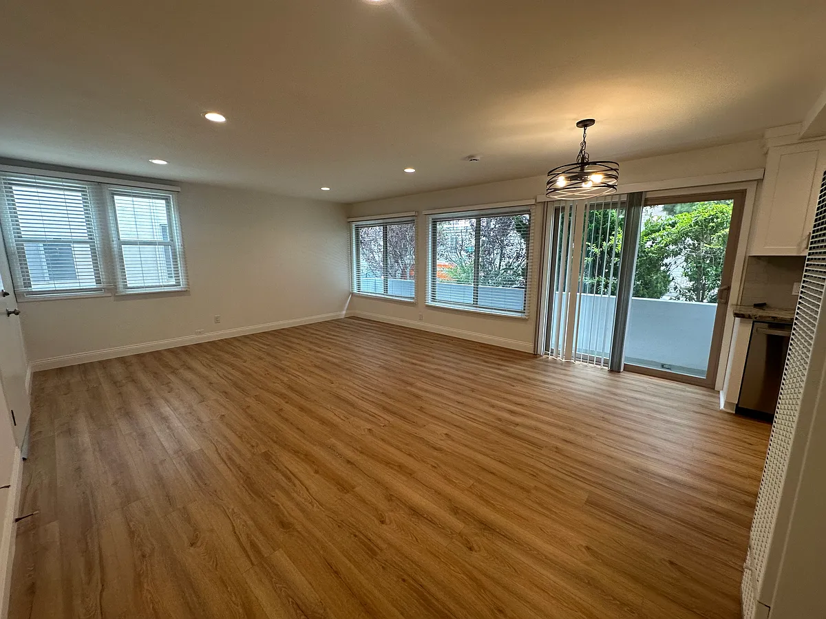 Open Living Area with large dual paned windows throughout that keep the unit insulated and quiet. - 421 Avenue G #A