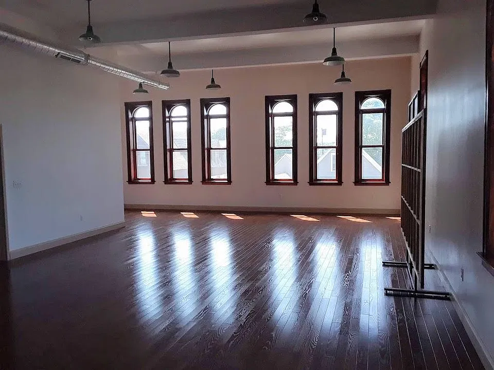 Facing the south windows.